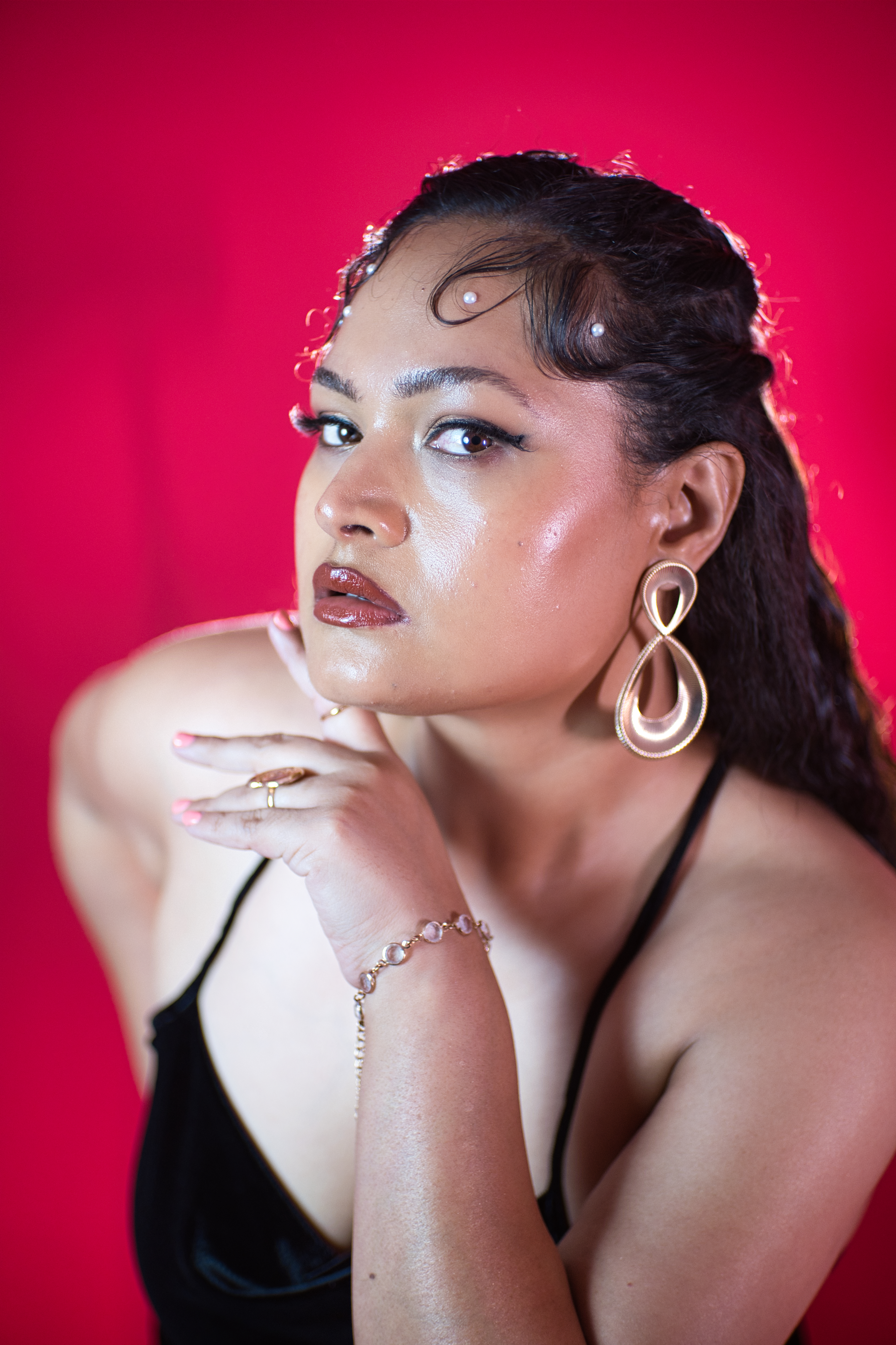 Beauty close-up of a model against a red backdrop